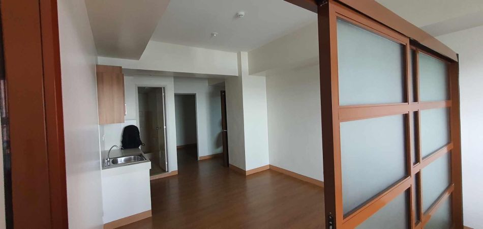 For Rent: 2 BR bare unit and parking with unobstructed view of Katipunan Avenue